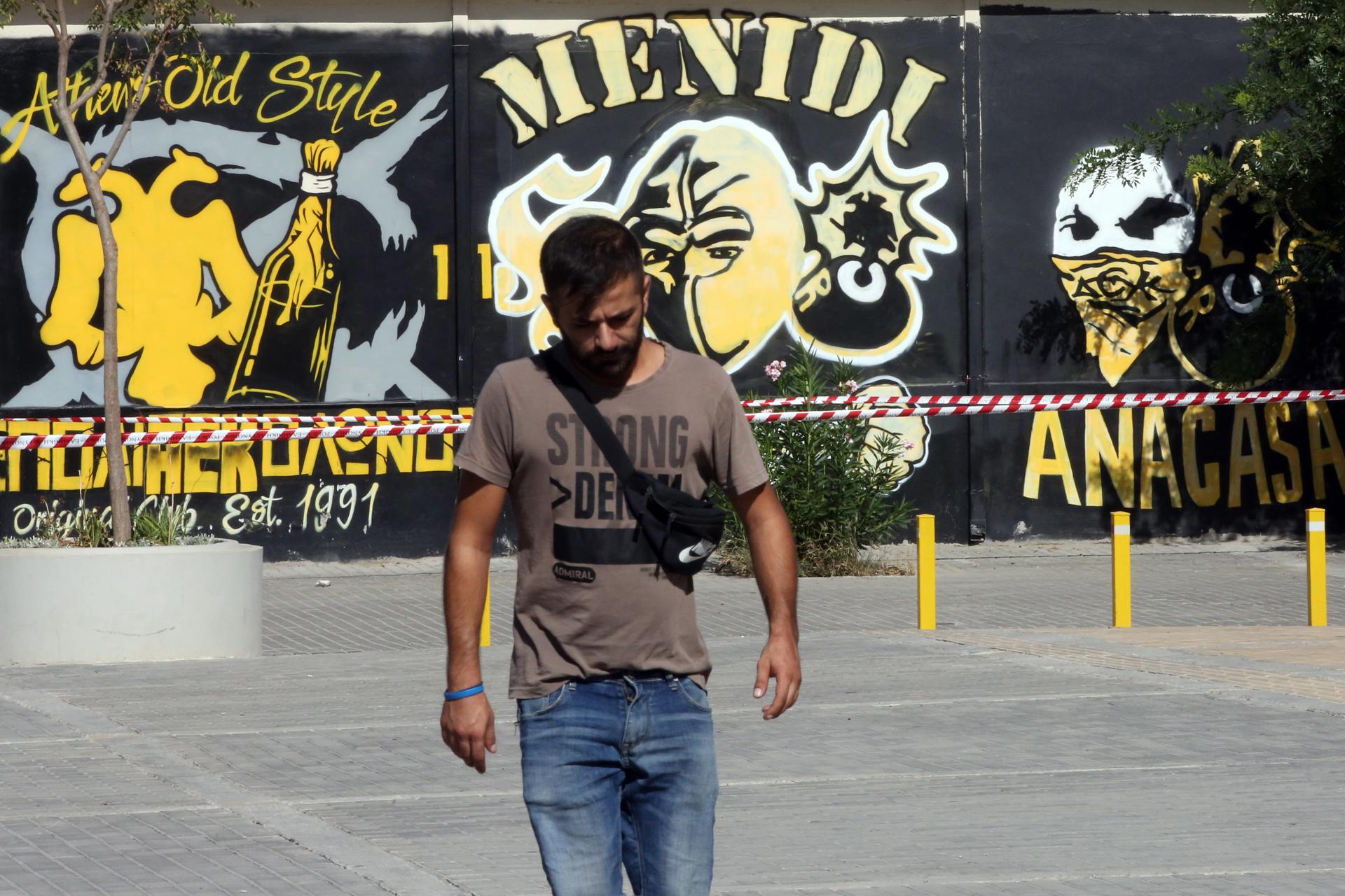 Athens (Greece), 08/08/2023.- A man walks at the spot where a 29-year-old EFE/EPA/ORESTIS PANAGIOTOU