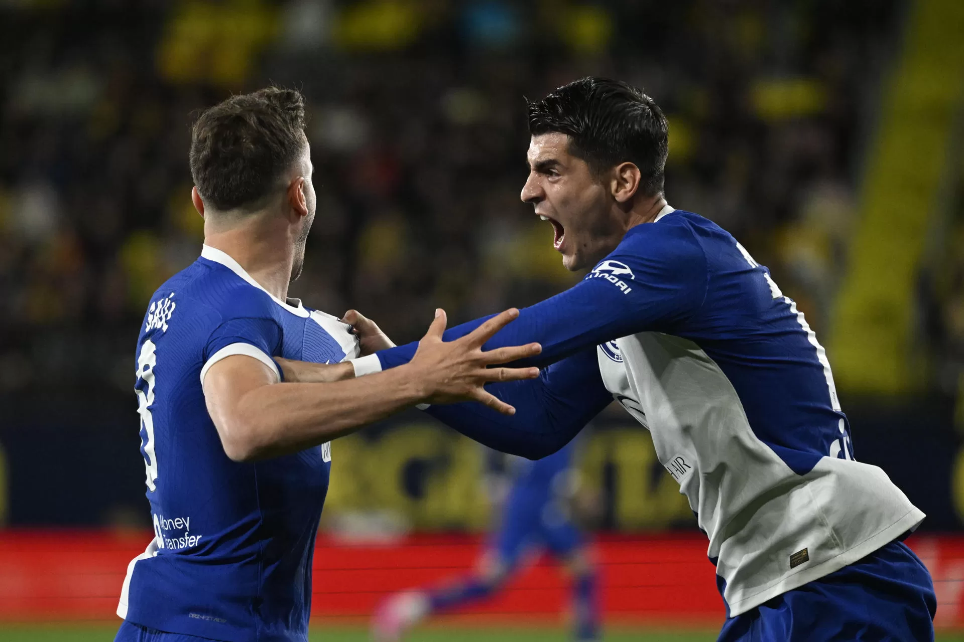 Saúl Ñíguez festeja el gol junto a Morata. EFE/Andreu Esteban 