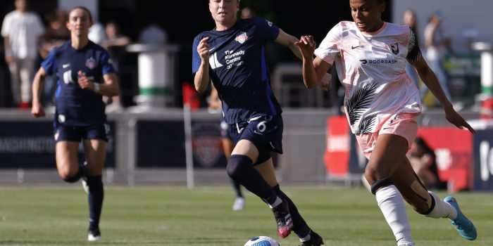 May 15, 2022; Washington, District of Columbia, USA; Angel City FC attacker Simone Charley (7) dribbles the ball as Washington Spirit defender Emily Sonnett (6) chases in the first half at Audi Field. Mandatory Credit: Geoff Burke-USA TODAY Sports